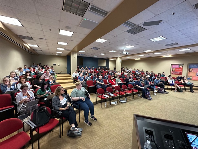 Full auditorium attending a lecture