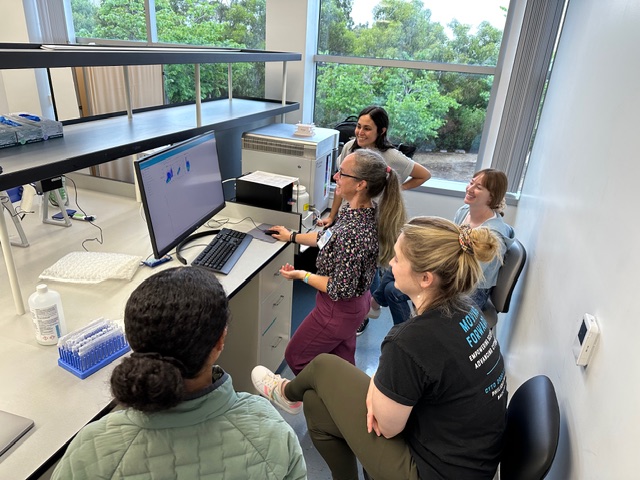 Students at a flow cytometer workstation