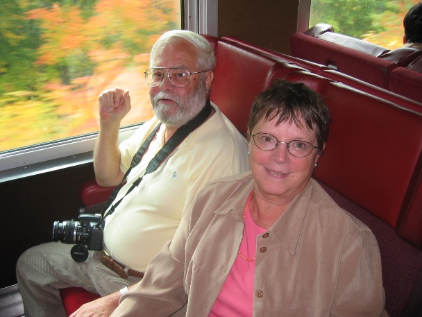 Two course participants on a scenic train through autumn foliage, 1993
