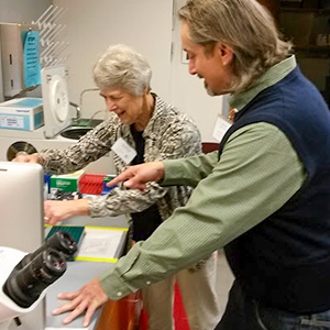 Two instructors demonstrating sample preparation